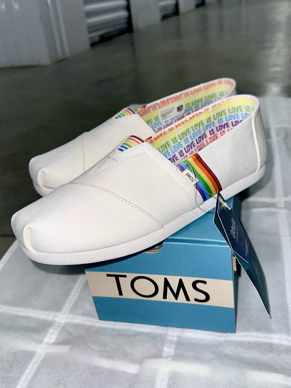 TOMS Classic White Slip-On with Rainbow Love Trim!